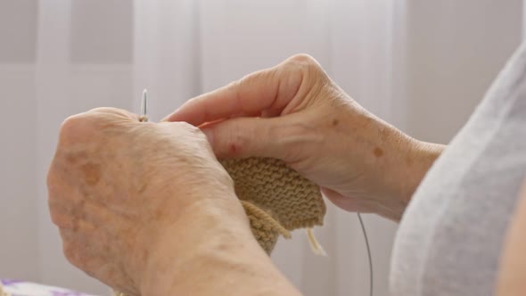 Closeup of Hands Knitting Warm Knitted Things for Their Beloved Relatives