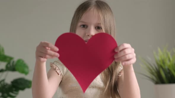 Cute Little Girl Smiling Giving Handmade Paper Red Heart