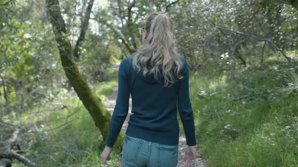 Girl Hiking In The Forest