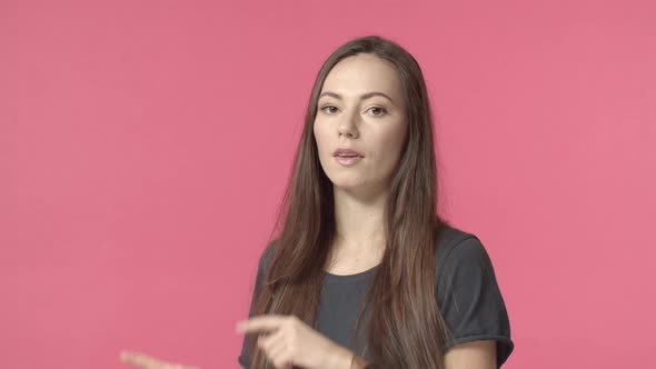 Sassy Goodlooking Lucky Caucasian Girl Giving Shot Pointing Fingers at Camera Inviting to Join Team