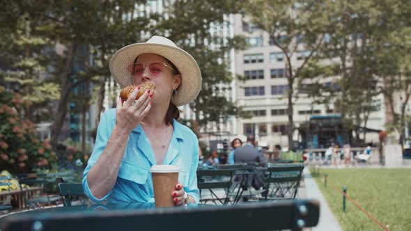 Eating young woman at the table