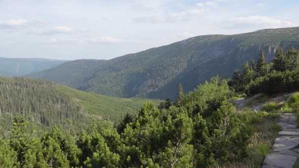 Nature with a Rocky Pathway Which Overlooks a View of Nature and Mountains.