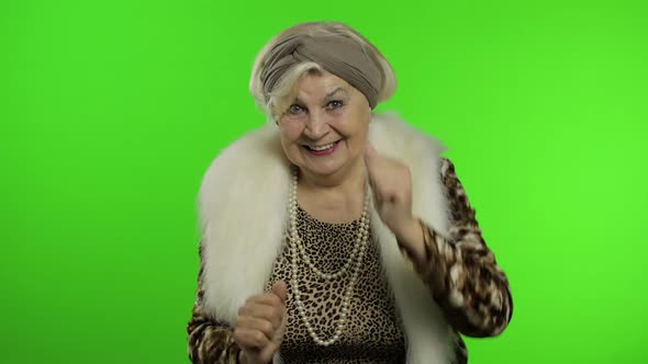 Elderly Stylish Grandmother. Caucasian Woman Claps Her Hands. Chroma Key