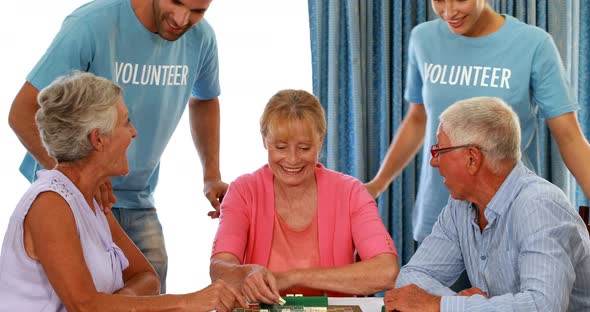 Senior couple playing puzzle