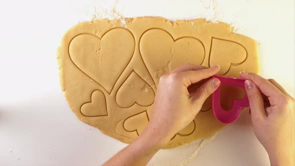 Chef Cutting the Dough Heart Shaped Cookie Cutter