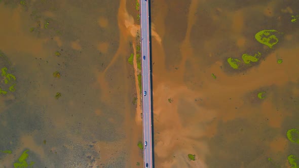 Drone video of the road leads through a large beautiful wetland.