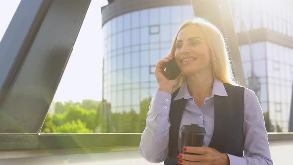 Portrait of Happy Senior Business Woman Calling Phone Outdoor