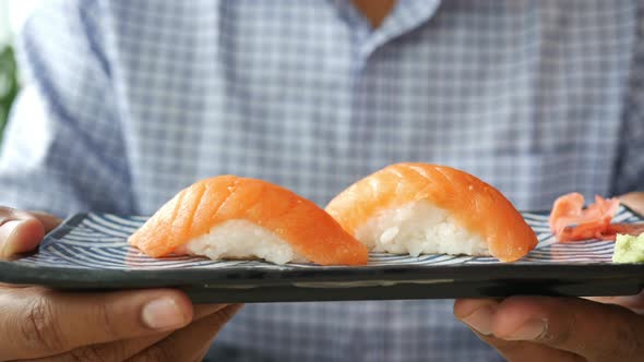 Traditional Japanese Nigiri Sushi with Salmon on Plate