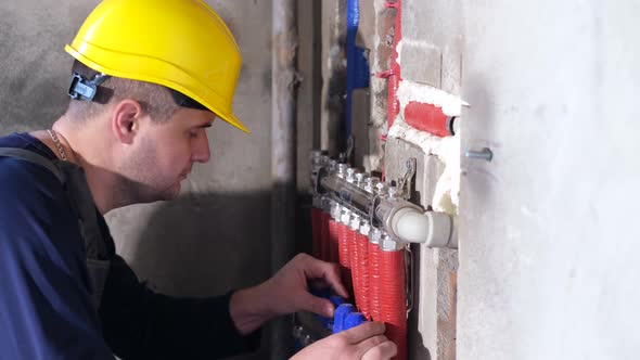 A Plumber Works in a New House