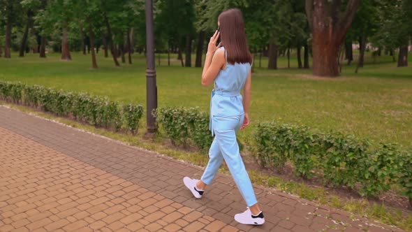 Female Talking By Phone on the Run