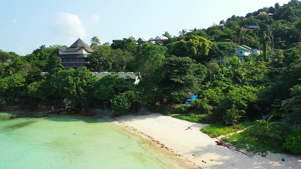 summer vacation concept. luxury house in the jungle with private sandy beach. aerial