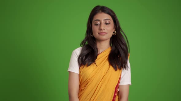 Pensive traditional Indian woman dancing