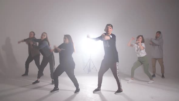 Young Group of Six Adult People Practice Dancing