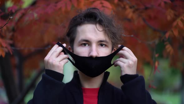 Portrait of a Teen in the City Streets During the Day, Wearing a Face Mask Against the Second Wave