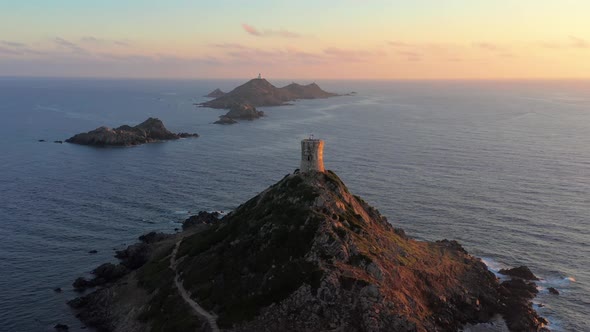 Aerial View Lighthouse on Mountain Rocky Hill in Sea Sunset