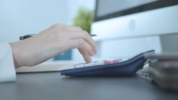 Accountant Working With Calculator