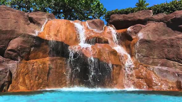 Waterfall flowing into a pool at the Hyatt Regency Maui Resort and Spa - Maui Hawaii