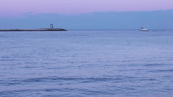 A Timelapse Fishing Boat Navigates the Sea