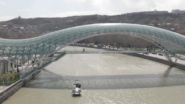 Tbilisi, Georgia - April 2 2021: Aerial view of Tbilisi city central park and Bridge of Peace.