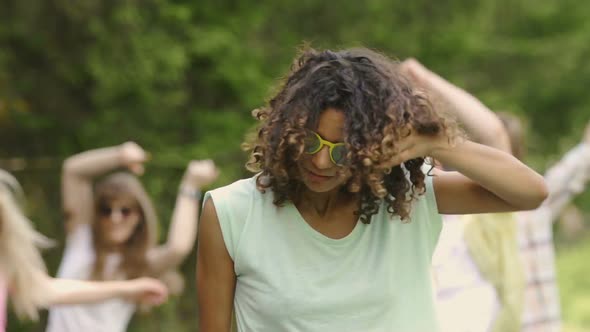 Flirty Mixed Race Female Hanging Out at Party in Park, Summer Weekend, Youth