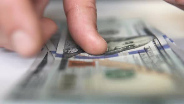 Hands counting dollar bills. The concept of investment, success, financial prospects.