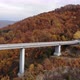 Aerial View of the Highway Viaduct on Concrete Pillars in the Mountains, Flight Over Autobahn - VideoHive Item for Sale