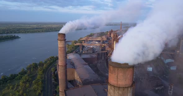 Aerial View of Industrial Zone with a Large Pipe Thick White Smoke