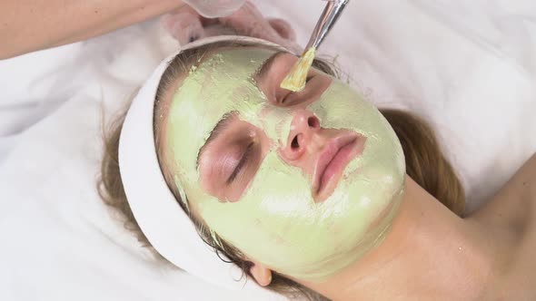 Closeup of the Client's Face with a Green Clay Mask