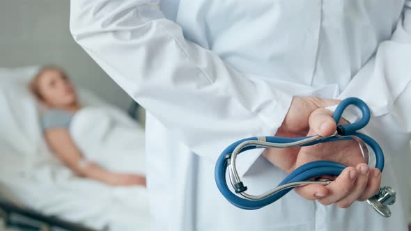 Doctor Standing with Stethoscope in a Hospital Room