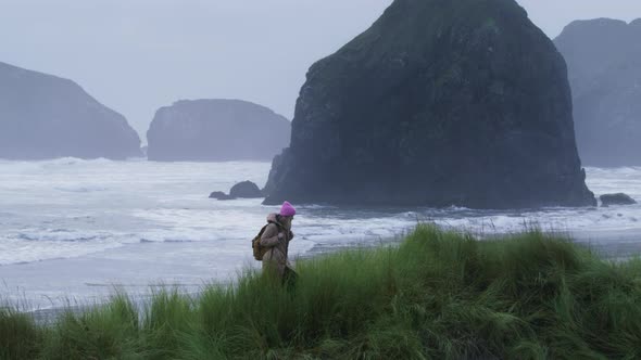 Slow Motion Beautiful Pacific Ocean Coast Traveler Woman Hiking By Grassy Hills