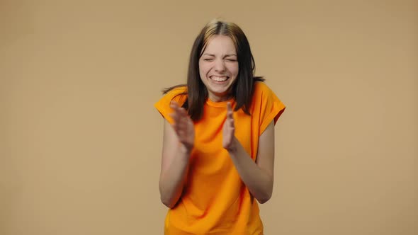 Portrait of Fashion Model Clapping Her Hands with Wow Happy Joy and Delight