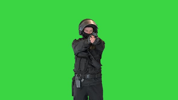 Police Tactical Unit Aiming with a Hand Gun on a Green Screen Chroma Key