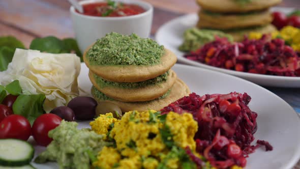 Close Up of Vegan Breakfast of Tofu Scramble, Pancakes and Vegetables. Healthy Lifestyle Concept.