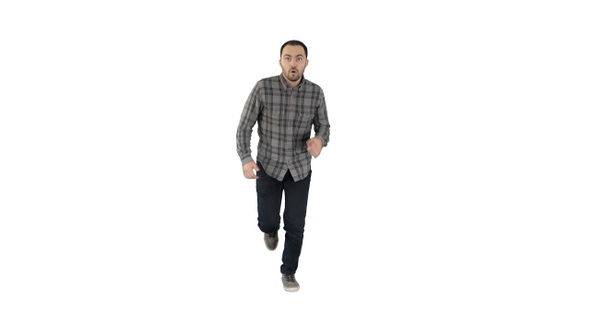 Man starting to run in casual clothes on white background.