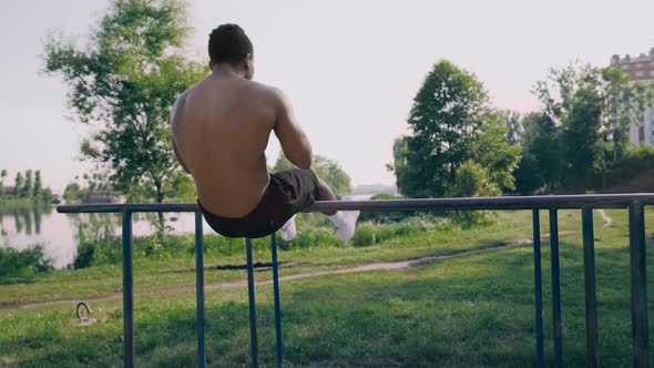 Shirtless Afro American Man Doing Stomach Workouts Outdoors