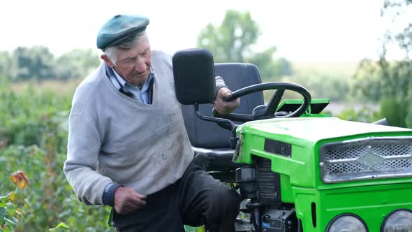 A 90Yearold Rural Worker Has Been Working on a Tractor in His Garden