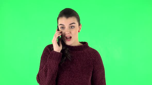 Girl Angrily Speaks on the Phone, Proves Something. Green Screen