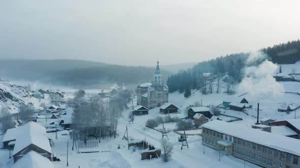 Aerial View of the Church in the Village in Winter