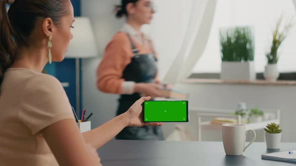 Business Woman Holding Phone with Mock Up Green Screen Chroma