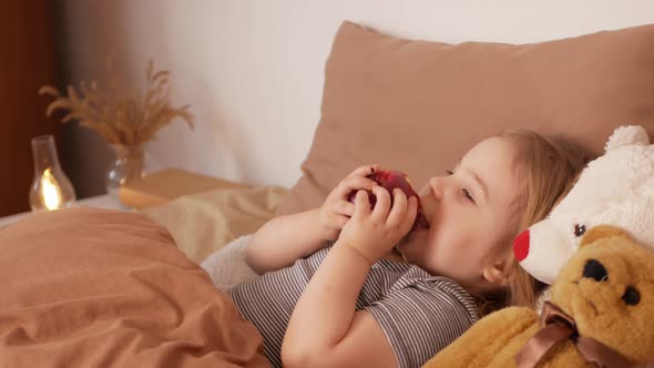 Little Girl Child Eats Apple Healthy Food Snack Bedroom