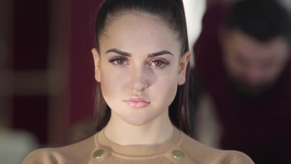 Close-up Face of Beautiful Caucasian Brunette Woman with Brown Eyes. Portrait of Young Gorgeous Girl