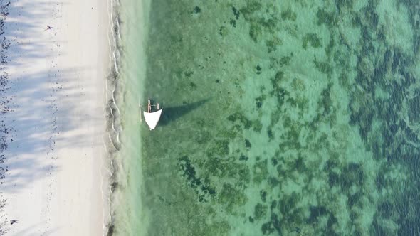 Vertical Video Boats in the Ocean Near the Coast of Zanzibar Tanzania Aerial View