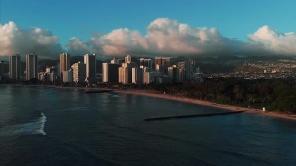 Aerial drone footage of Honolulu, Hawaii. Beautiful real estate, buildings in the city. Palm trees