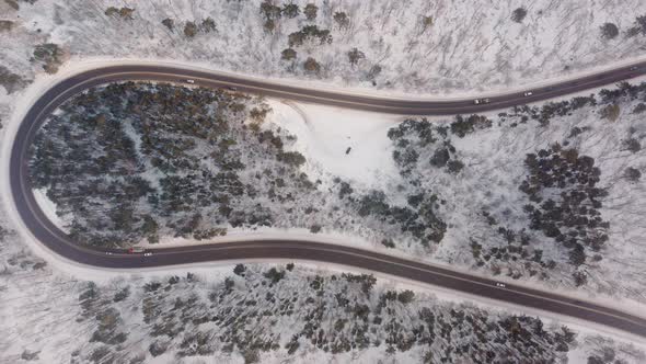 Riding a car on a winter road The drone view of winter driving Forest Winter Travel Russia