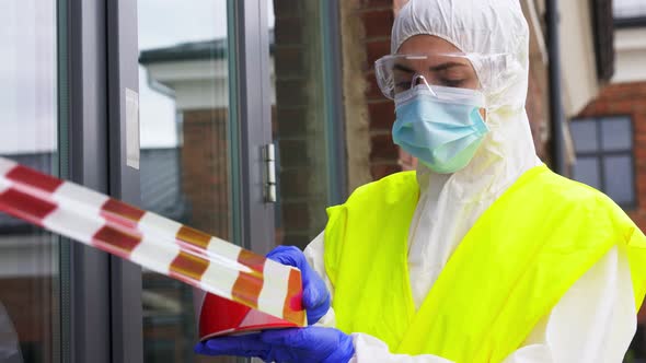 Healthcare Worker Sealing Door with Caution Tape