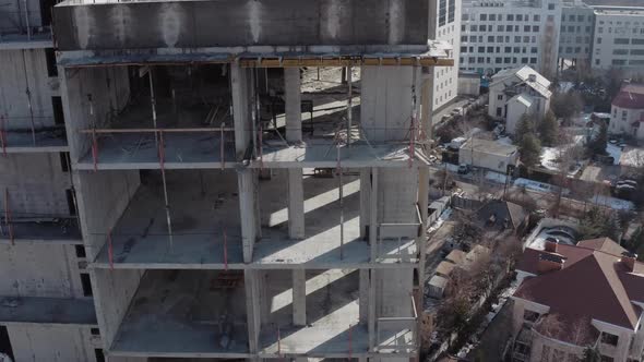 Aerial Shot From the Side of a Multi-storey Residential Building During Construction