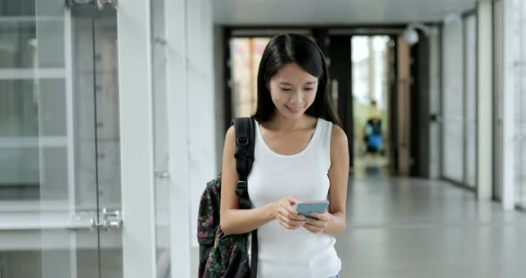 Woman using mobile phone in the university school 