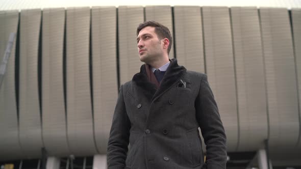 Businessman standing outside a building