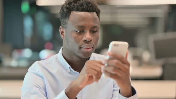 Portrait of African Businessman Using Smartphone
