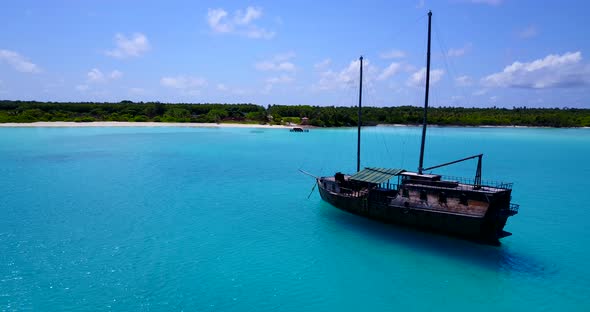 Natural aerial clean view of a sandy white paradise beach and turquoise sea background in hi res 4K